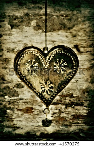 gold metal heart on vintage background
