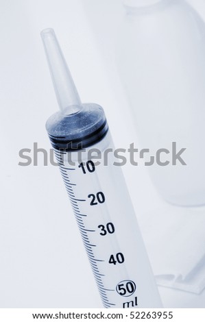 a syringe and other medical stuff isolated on a white background