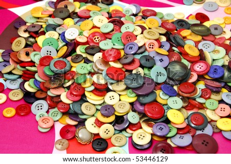 buttons of many colors and shapes on a background of different colors