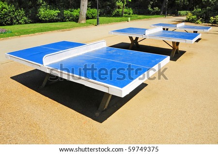 some ping pong tables in a public park