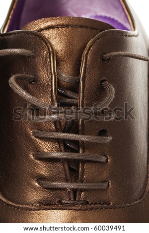 closeup of a patent leather shoe for man isolated on a white background