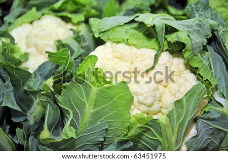 closeup of some cauliflowers in a vegetables market