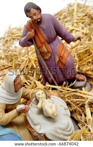 figures representing nativity scene on white background