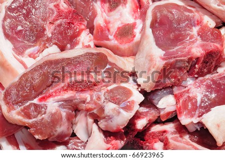 closeup of a pile of raw pork chops
