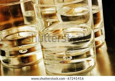 closeup of some glasses with mixed drinks in a club