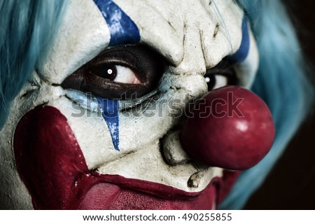 closeup of a scary evil clown