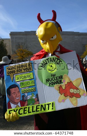 WASHINGTON, DC - OCT 30: A man dressed as the Simpsons\' Mr. Burns holds a sign at the Stewart/Colbert Rally to Restore Sanity and/or Fear, Oct. 30, 2010 on the National Mall in Washington, DC.