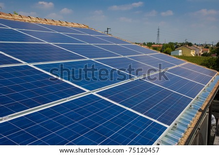 Solar panel on a house roof. Photovoltaic energy. Green energy from sun.