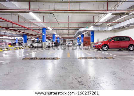 Parking Garage, Underground Interior With A Few Parked Cars