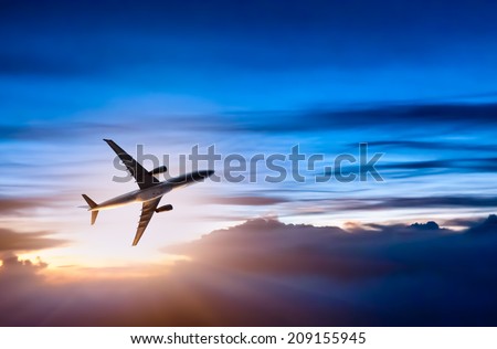 Airplane in the sky at sunrise