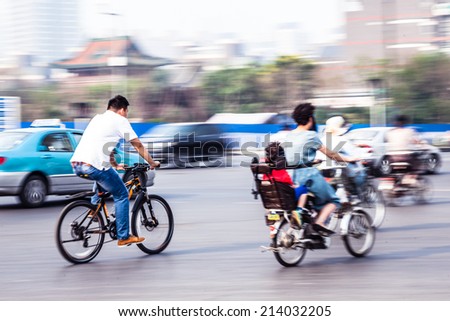 bicycle riders in the city in motion blur