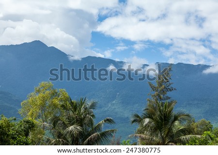 Under the blue sky and white clouds in the mountains