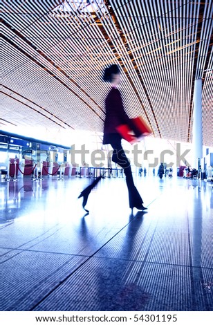 Woman hurrying in airport.