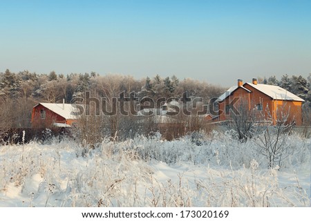 Snow house in winter dreamland at dawn in forest.