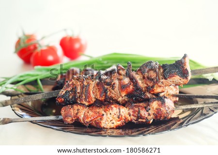 grilled pork meat on the plate, pork barbecue. small depth of field
