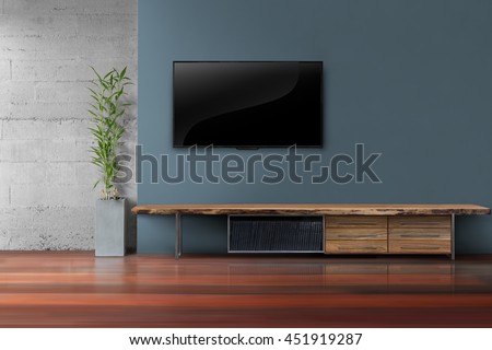 Living room led tv on dark blue with wooden table and plant in pot modern loft style