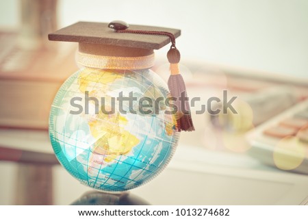 Graduate study abroad concept, Graduation cap on top Earth globe model map with Radar background. Graduate study abroad program and Back to School and Studies lead to success in world wide.