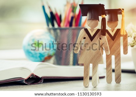 Australia Education knowledge learning study abroad international Ideas. People Sign wood with Graduation celebrating cap on open textbook with model global map, alternative studying world wide