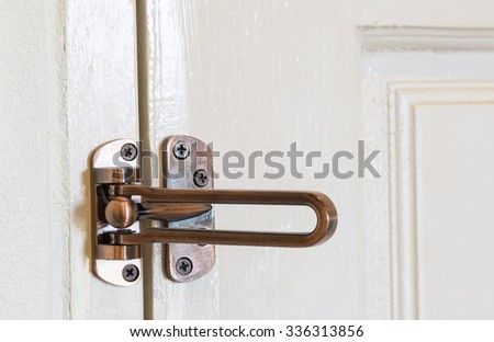 modern style door handle on wooden door.