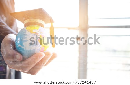 Education in Global, Graduation cap on Businessman holding Earth globe model map with Radar background in hands. Concept of global business, abroad educational, Back to School.