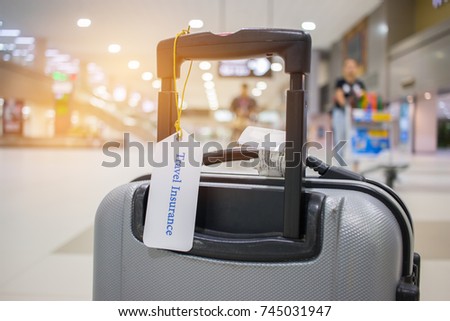 Travel Insurance tag on suitcase holder with tag tied letters enjoyable your trip on bag. Travel Insurance is intended cover medical expenses, cover lost luggage, flight cancellation or accident.