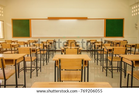 Lecture room or School empty classroom with desks and chair iron wood for studying lessons in high school Thailand, interior of secondary education, with whiteboard, vintage tone educational concept