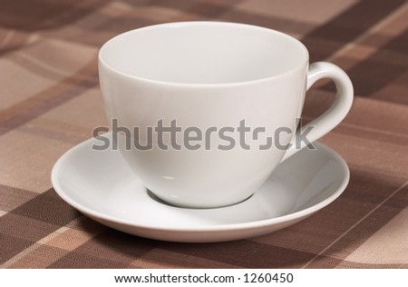 Closeup of teacup on table-cloth