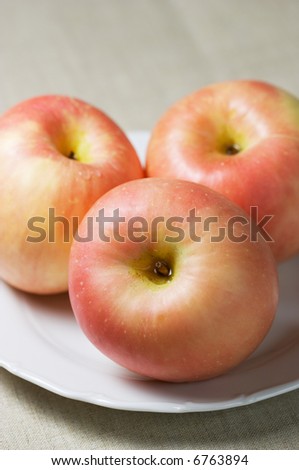 Closeup of three apples (fuji) #2. Shallow focus depth on front apple