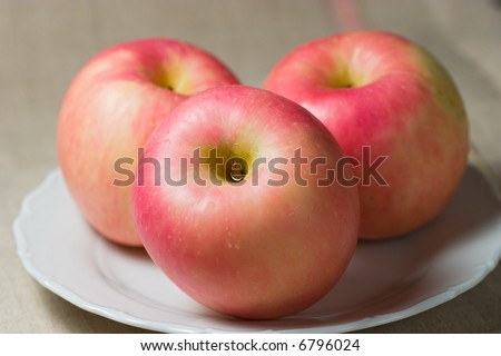 Closeup of three apples (fuji) #3. Shallow focus depth on front apple