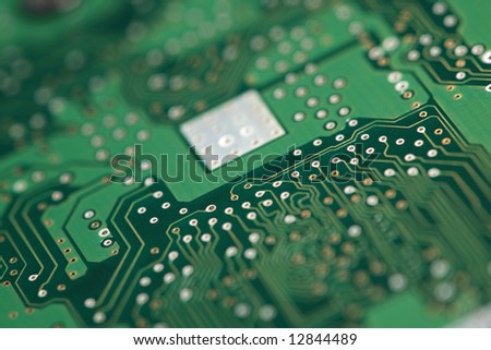 Micro chip on system board. Shallow focus depth on center of board