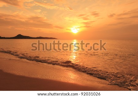 Sunrise landscape on ocean beach - water waves, sun, sky. Thailand, Koh Samui