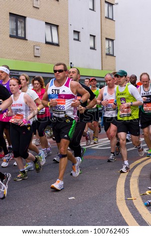 LONDON - APRIL 22: Unidentified men run the London marathon on April 22, 2012 in London, England, UK. The marathon is an annual event.