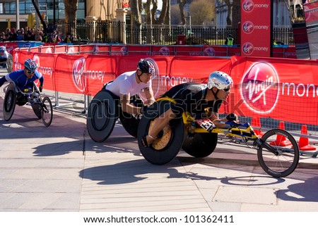 LONDON - APRIL 22: Unidentified wheelchair racers at the London marathon on April 22, 2012 in London, England, UK. The marathon is an annual event.