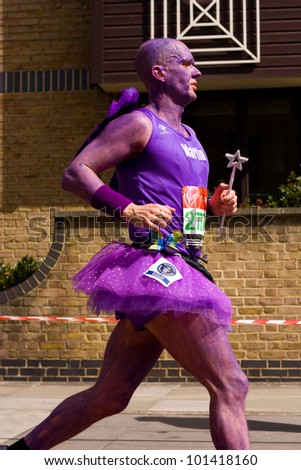 LONDON - APRIL 22: Unidentified man runs the London marathon on April 22, 2012 in London, England, UK. The marathon is an annual event.