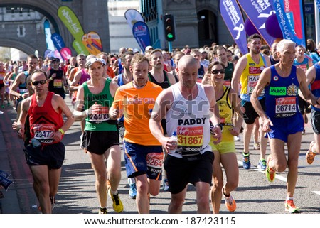 LONDON - APRIL 13: Unidentified men run the London marathon on April 13, 2014 in London, England, UK. The marathon is an annual event.