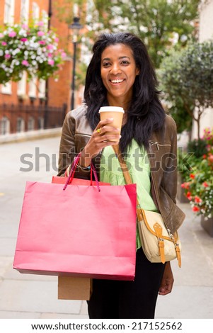 young woman with coffee bags and coffee