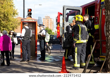 LONDON - OCTOBER 11TH: The fire brigade attend an emergency in waterloo on October 11th, 2014 in London, England, UK. London\'s fire and rescue service is the busiest in the country