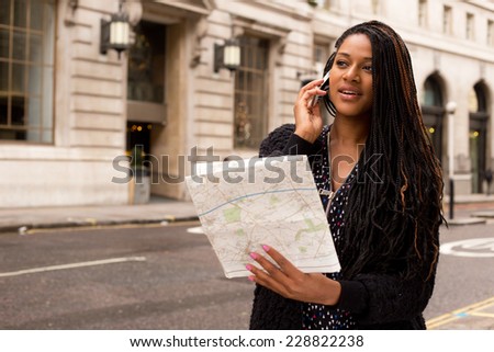 young woman on the phone with a map