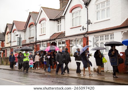 LONDON - MARCH 29TH: Unidentified people at a palm sunday procession on March the 29th, 2015, in London, England, UK. Palm sunday is an annual religious celebration.