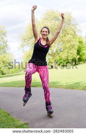young woman balancing on her roller skates
