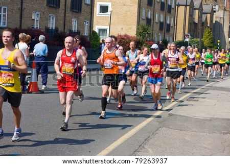 LONDON - APRIL 17: Unidentified men run the London marathon on April 17, 2011 in London, England, UK. The marathon is an annual event.