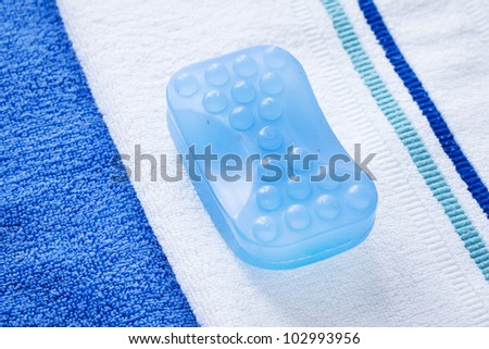Massage soap bar on double towel