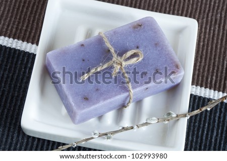 Soap bar with natural ingredients in dish