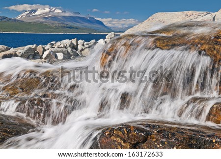 Falls on the bank of the lake in national park Sarek in Sweden.