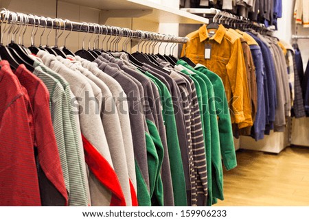 Men Clothing in Fashion Store - Fleece Shirts on the Store Rack