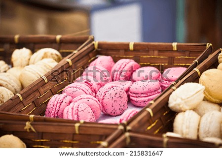 Macarons assortment in a wickered boxes. Horizontal shot with selective focus