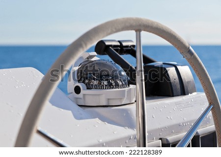 Sailing yacht control wheel and implement. Horizontal close up shot without people