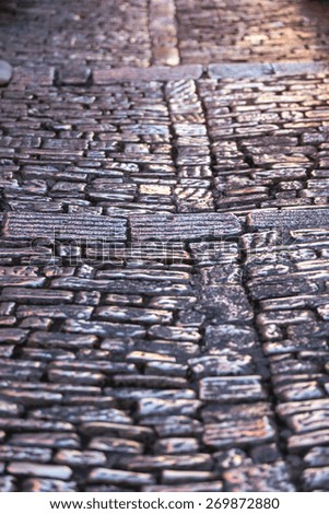 Cobblestone Pavement Close Up Background. Vertical Shot with a selective focus