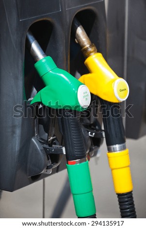 Petrol pump nozzles in a service station
