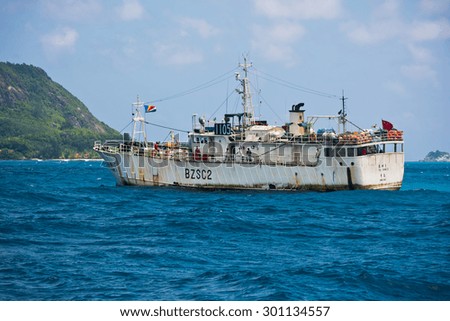 SEYCHELLES, MAHE - JANUARY 11: Old Chinese cargo ship sailing in the Indian ocean near Seychelles islands on January 11, 2015